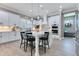 Modern kitchen with a large island, stainless steel appliances, and white cabinets and countertops at 13139 Stanthorne Ave, Orlando, FL 32832