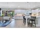 Bright open concept kitchen with white cabinets, white countertops, and stainless steel appliances at 13139 Stanthorne Ave, Orlando, FL 32832