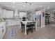 Modern kitchen with white cabinetry, center island, and stainless-steel appliances in an open layout at 13139 Stanthorne Ave, Orlando, FL 32832
