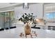 Bright kitchen featuring white cabinets, marble countertops, stainless steel appliances, and decorative center piece on island at 13139 Stanthorne Ave, Orlando, FL 32832