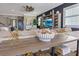 Comfortable living room with stylish decor, neutral tones, and a view into the open concept design at 13139 Stanthorne Ave, Orlando, FL 32832