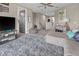 Relaxing upper living room featuring a large sectional, media center, and comfortable seating at 13139 Stanthorne Ave, Orlando, FL 32832