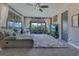 Spacious living room with large sliding glass doors to the outdoor patio, a comfy couch, and a plush rug at 13139 Stanthorne Ave, Orlando, FL 32832