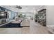 Spacious living room features an open layout, neutral decor, hardwood floors, and modern furnishings at 13139 Stanthorne Ave, Orlando, FL 32832