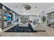 Spacious living room with modern decor, large sectional sofa, and ample natural light at 13139 Stanthorne Ave, Orlando, FL 32832