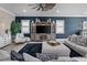 Comfortable living room with dark accent wall, plush seating, and stylish decor creates a cozy atmosphere at 13139 Stanthorne Ave, Orlando, FL 32832