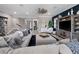Bright living room boasts neutral colors, hardwood floors, and a sectional sofa for comfort and style at 13139 Stanthorne Ave, Orlando, FL 32832