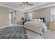 Spacious main bedroom featuring a ceiling fan, natural light and neutral paint at 13139 Stanthorne Ave, Orlando, FL 32832