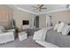 Bright main bedroom with sitting area, ceiling fan, and ensuite access at 13139 Stanthorne Ave, Orlando, FL 32832