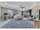 Bright main bedroom features trey ceiling, a ceiling fan and access to the lanai for outdoor living at 13139 Stanthorne Ave, Orlando, FL 32832