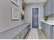 Mudroom featuring built-in cabinets, a bench and an exterior door at 13139 Stanthorne Ave, Orlando, FL 32832