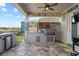 Outdoor bar with stainless steel grill and sink perfect for backyard cookouts at 13139 Stanthorne Ave, Orlando, FL 32832