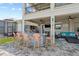 Outdoor covered bar area with seating, TV, and lounge, perfect for entertaining at 13139 Stanthorne Ave, Orlando, FL 32832