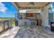 Outdoor kitchen with built in grill and island with bar seating, perfect for entertaining at 13139 Stanthorne Ave, Orlando, FL 32832