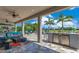 Spacious outdoor living area featuring a full outdoor kitchen, pool, and comfortable seating at 13139 Stanthorne Ave, Orlando, FL 32832