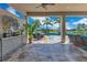 Covered outdoor patio overlooking a pool and beautiful green space at 13139 Stanthorne Ave, Orlando, FL 32832