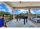Outdoor patio with a foosball table and comfortable seating at 13139 Stanthorne Ave, Orlando, FL 32832