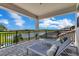 Covered outdoor patio featuring chaise lounges overlooking a lush landscape at 13139 Stanthorne Ave, Orlando, FL 32832