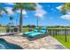 Poolside lounge chairs offer a relaxing view of the surrounding landscaping at 13139 Stanthorne Ave, Orlando, FL 32832