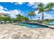 Beautiful outdoor pool area with ample seating, landscaping and a spacious deck at 13139 Stanthorne Ave, Orlando, FL 32832