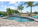 Beautiful backyard featuring a pool, lush landscaping, and comfortable outdoor seating at 13139 Stanthorne Ave, Orlando, FL 32832