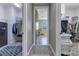 Hallway view to the walk-in closet showing ample space with shelving on both sides of the corridor at 13139 Stanthorne Ave, Orlando, FL 32832