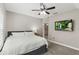 Bedroom featuring a ceiling fan, tv, and ample natural light from the window at 1330 W Harvard St, Orlando, FL 32804