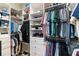 Spacious walk-in closet with custom shelving and storage solutions for clothes, shoes, and accessories at 1330 W Harvard St, Orlando, FL 32804