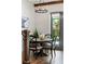Cozy dining area featuring modern lighting, a round table, and a view of the outdoors at 1330 W Harvard St, Orlando, FL 32804