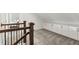 Upstairs hallway with built-in storage cabinets and railing with a view to the landing below at 1330 W Harvard St, Orlando, FL 32804