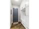 Mud room features white built-in cabinets, drawers, and a convenient bench for storage and organization at 1330 W Harvard St, Orlando, FL 32804