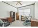 Bedroom with dark wood furniture and a ceiling fan at 1354 S Shore Dr, St Cloud, FL 34771