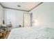 Cozy bedroom with white walls, floral wallpaper border, and comfortable king size bed at 1354 S Shore Dr, St Cloud, FL 34771