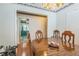 Inviting dining room with hardwood floors and view into kitchen at 1354 S Shore Dr, St Cloud, FL 34771