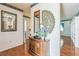 Elegant foyer featuring hardwood floors, decorative wallpaper, and unique wall decorations at 1354 S Shore Dr, St Cloud, FL 34771