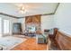 Cozy living room featuring a brick fireplace with a wooden mantel and classic decor at 1354 S Shore Dr, St Cloud, FL 34771