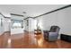 Open-concept living room with gleaming hardwood floors and bright natural light at 1354 S Shore Dr, St Cloud, FL 34771