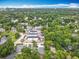 An aerial view shows this property's close proximity to the surrounding lush green landscape and downtown at 1414 Beaver Pl, Orlando, FL 32806
