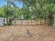 Fenced backyard with mature trees provides privacy at 1414 Beaver Pl, Orlando, FL 32806