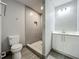 Updated bathroom features a tiled shower, modern vanity and new fixtures at 1414 Beaver Pl, Orlando, FL 32806