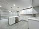 Spacious kitchen with stainless steel appliances, a large island, and open access to the living room at 1414 Beaver Pl, Orlando, FL 32806