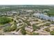 Expansive aerial view of a well-planned community with homes surrounding lakes and green spaces at 14820 Laguna Beach Cir, Orlando, FL 32824