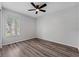 Bright bedroom with wood floors and a ceiling fan at 14820 Laguna Beach Cir, Orlando, FL 32824