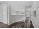 Upstairs hallway with wood floors and modern gray paint at 14820 Laguna Beach Cir, Orlando, FL 32824