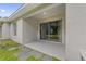 Back patio with stone pavers, sliding glass door, and room for outdoor seating at 14820 Laguna Beach Cir, Orlando, FL 32824