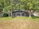 Large backyard featuring a screened-in pool, perfect for outdoor enjoyment and entertaining at 1513 Blue Sky Way, Clermont, FL 34714
