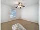 Spare bedroom with a window and a ceiling fan at 1513 Blue Sky Way, Clermont, FL 34714