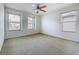 Bedroom features three large windows that let in lots of natural light at 1513 Blue Sky Way, Clermont, FL 34714