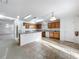 Bright kitchen with an eat-in island, modern appliances, and ample cabinet space is perfect for cooking at 1513 Blue Sky Way, Clermont, FL 34714