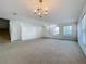 Spacious and open living area with large windows offering plenty of natural light at 1513 Blue Sky Way, Clermont, FL 34714